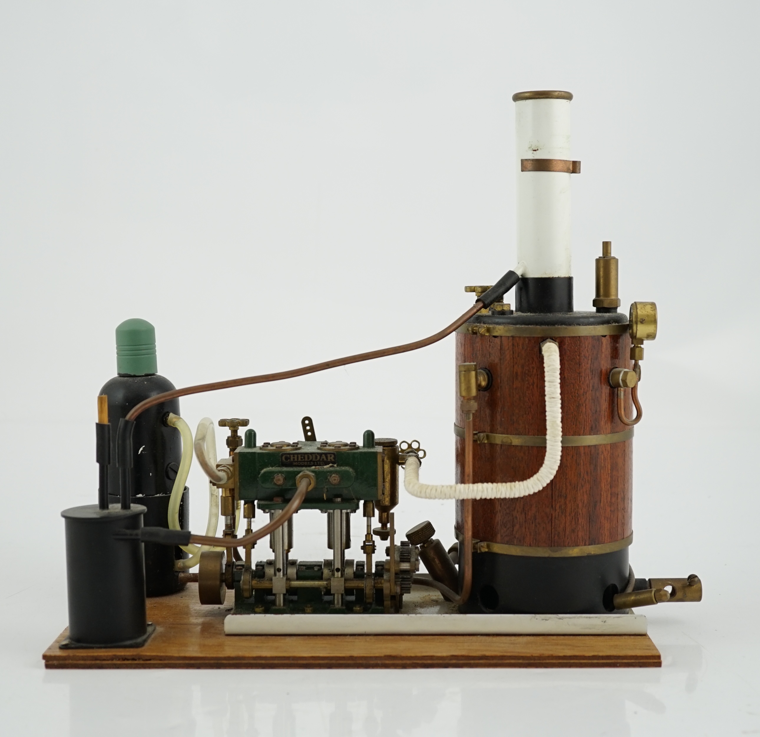 A Cheddar Models Ltd. Proteus steam plant, a gas fired vertical boiler two cylinder marine engine, with a wood clad copper boiler fitted with pressure gauge, water sight glass and safety valve